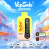 Yellow-pink VapSolo OG18000 disposable vape with Strawberry Banana flavor, featuring dual Smart/Boost modes, dual digital displays, and 0.9Ω mesh coil.